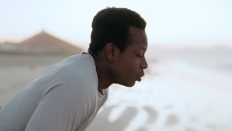 tired runner, man and breathing at beach