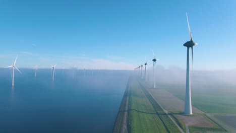 huge windmill turbines, offshore windmill farm in the ocean westermeerwind park , windmills isolated at sea on a beautiful bright day netherlands flevoland noordoostpolder