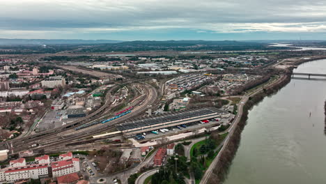 overhead sweep of avignon, framed by the shimmering rhône river.