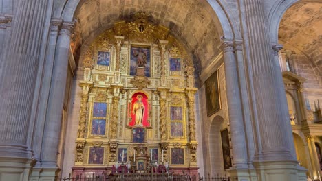 beautiful catholic altar made with gold inside malaga cathedral in spain