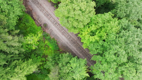 Downward-Spiral-Drone-Shot:-Top-Down-View-of-Well-Maintained-Railroad-Tracks-in-Vermont