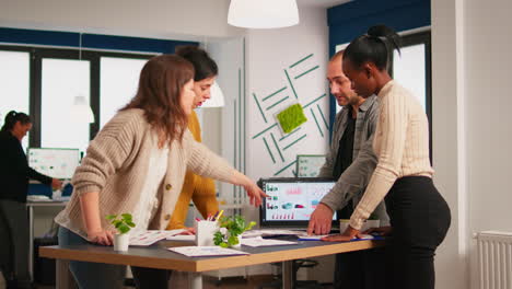 diverse business people communicating in start up business office standing over desk