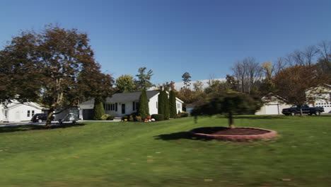drive forward on a road through a typical american city. side view