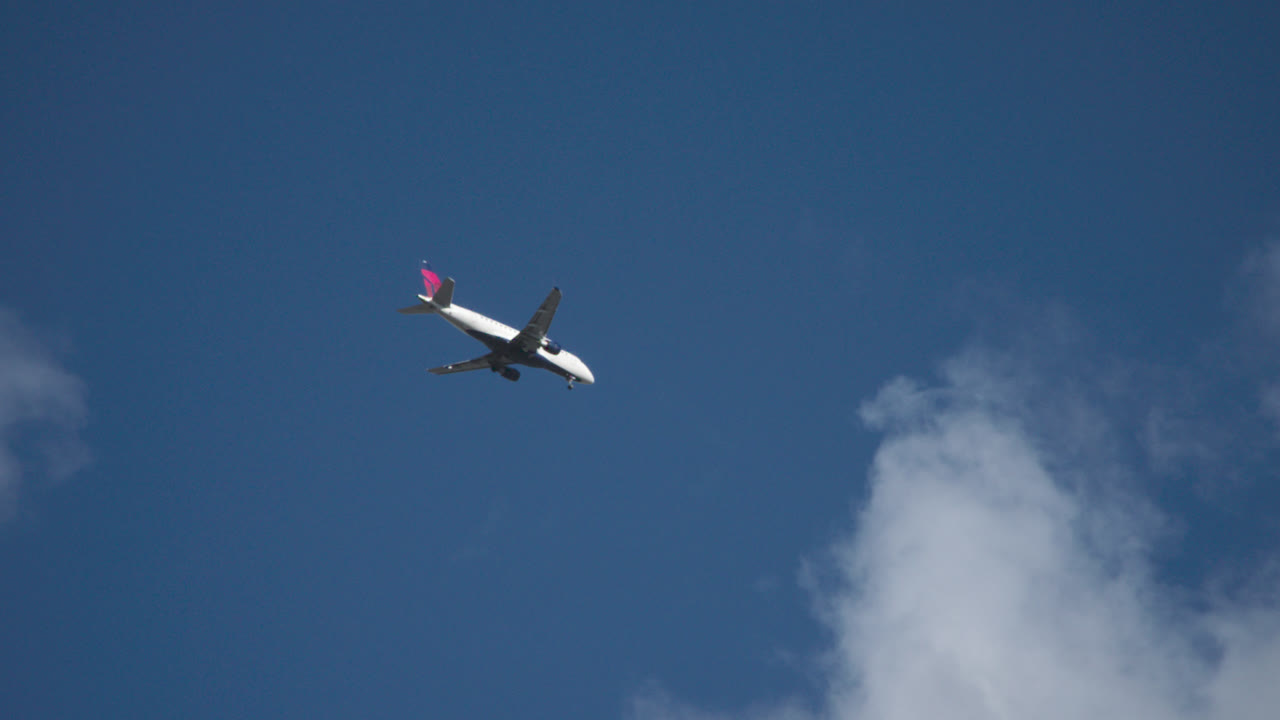 Closeup shot of a commercial airplane flying overhead