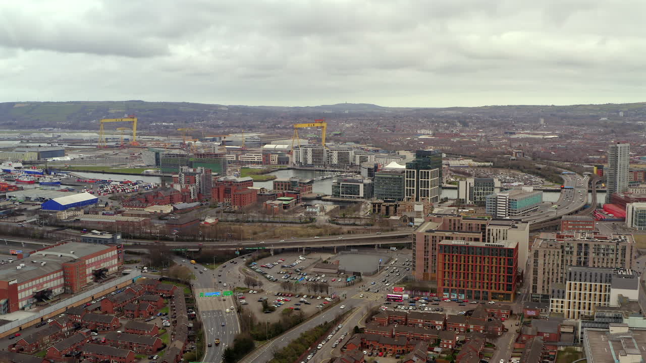 Wide aerial pan of central Belfast during St. Patrick's Day