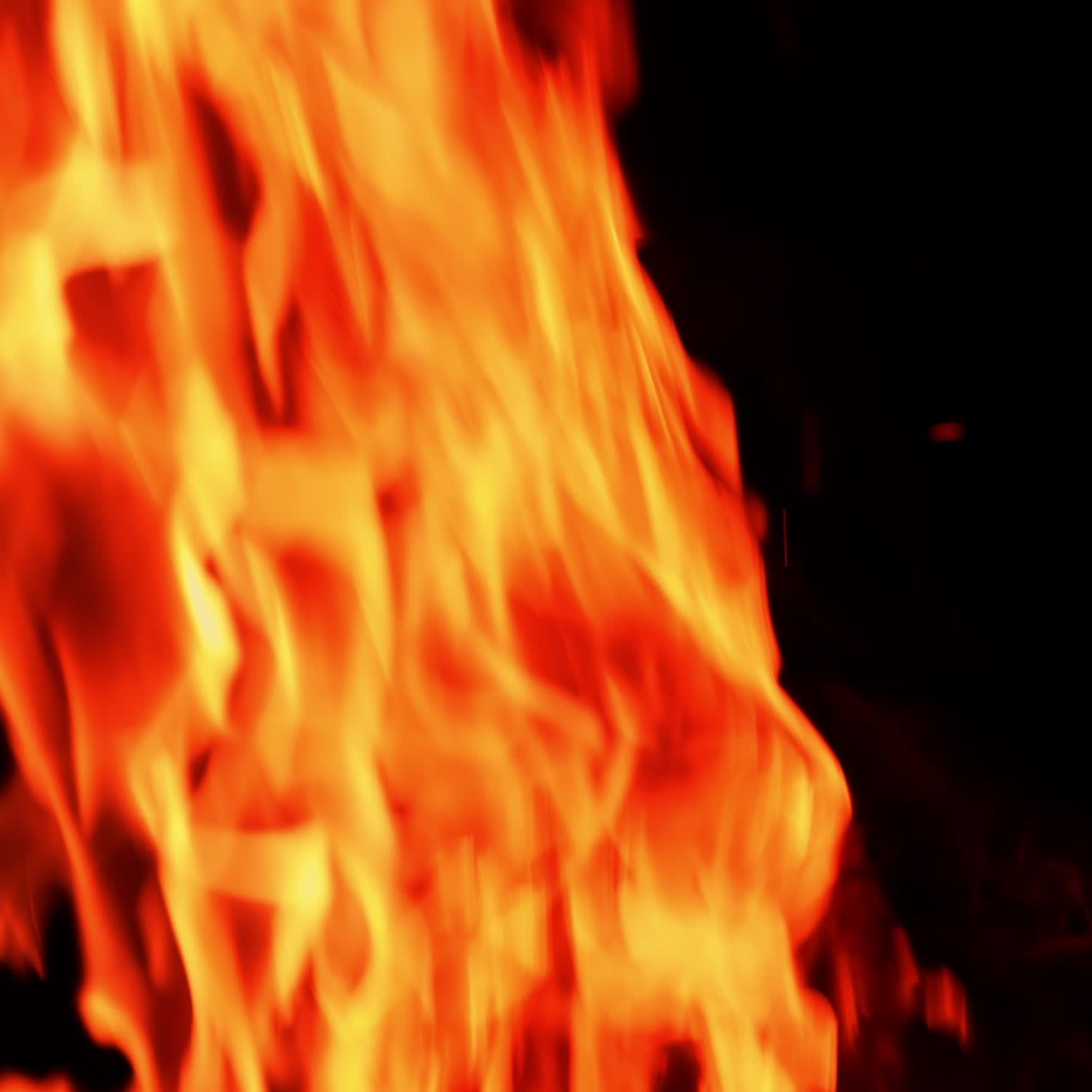 Flame orange glowing at campfire. Flame fire on dark background