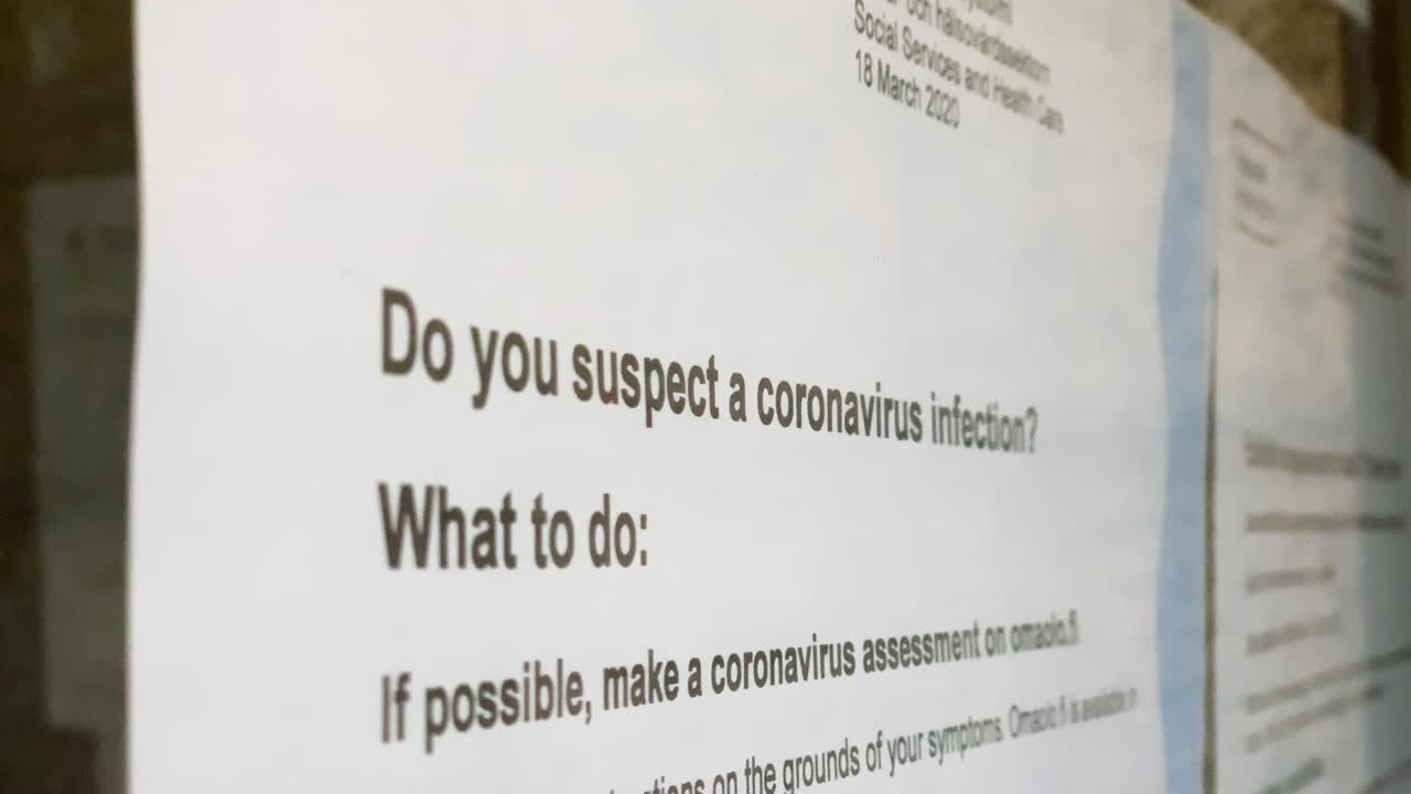 COVID19 note on a glass door - Do you suspect a coronavirus infection