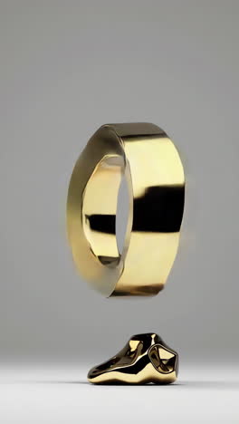 abstract golden metallic shapes floating on a minimalist background