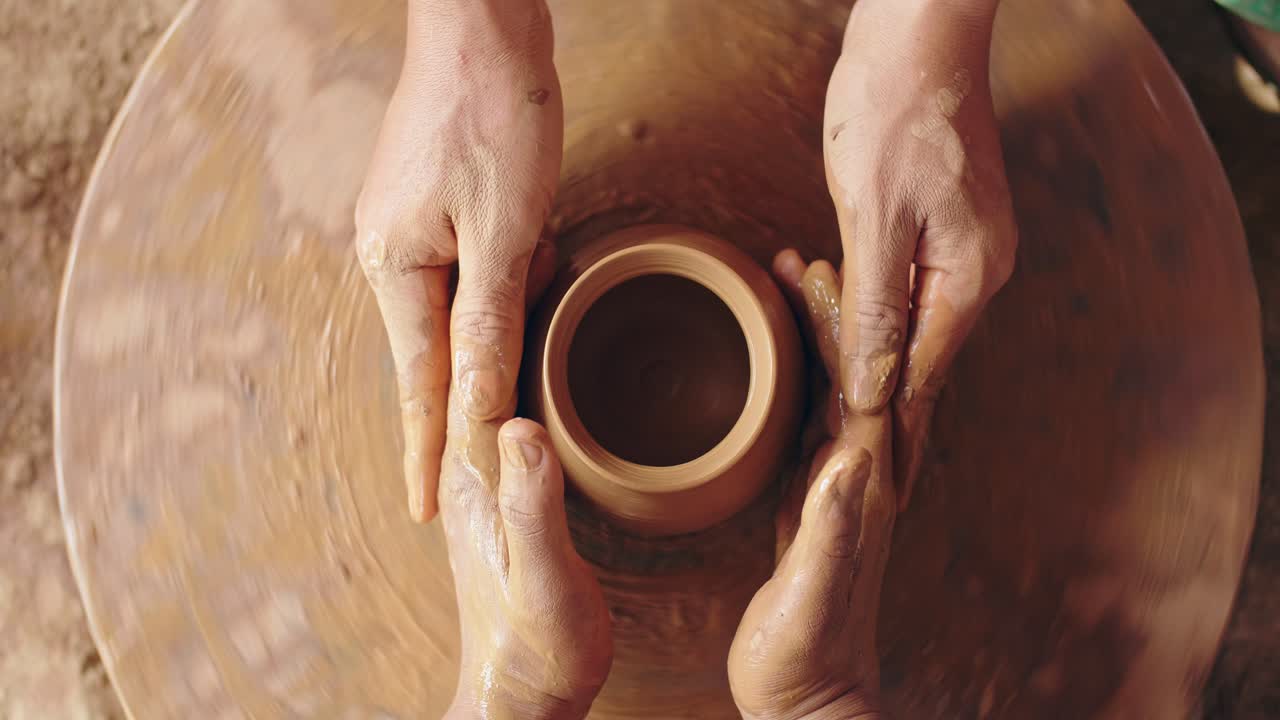 A Potters Hands Guiding A Tourist Hands To Help Him To Work, Video In 4K