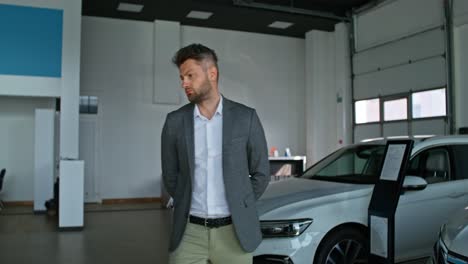 man in a car dealership