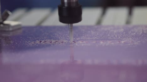 cnc router cutting purple plastic