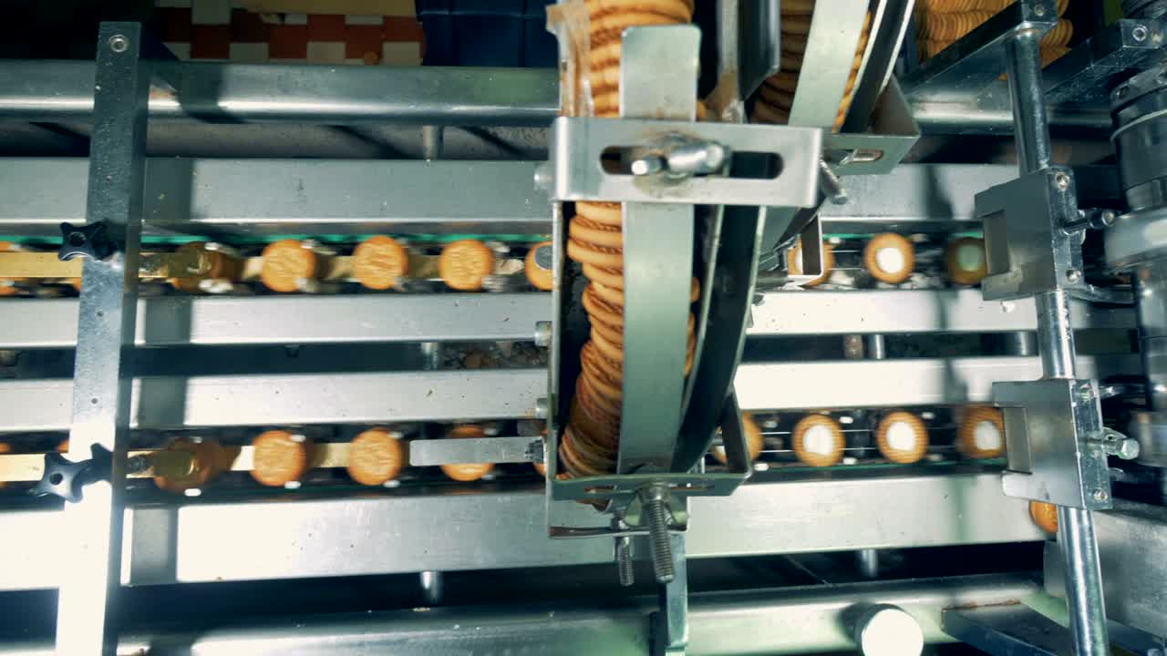 Dynamic footage of biscuits making process by a factory machine