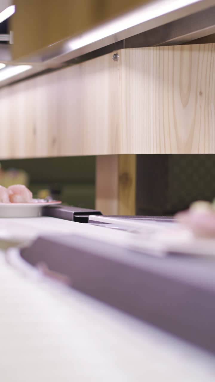 Dishes moving on conveyor sushi in Japan bringing unique dining experiences