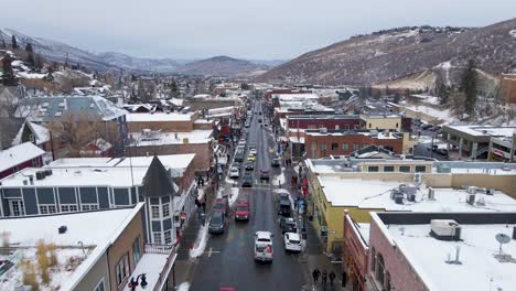 Busy-Crowds-of-Touristic-Main-Street,-Park-City-in-the-Winter,-Aerial