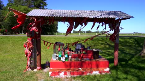 a shrine in honor of gauchito gil near a provincial route