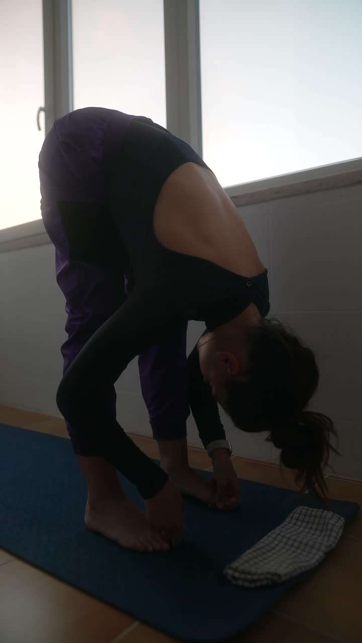 Woman Performing Yoga Forward Fold