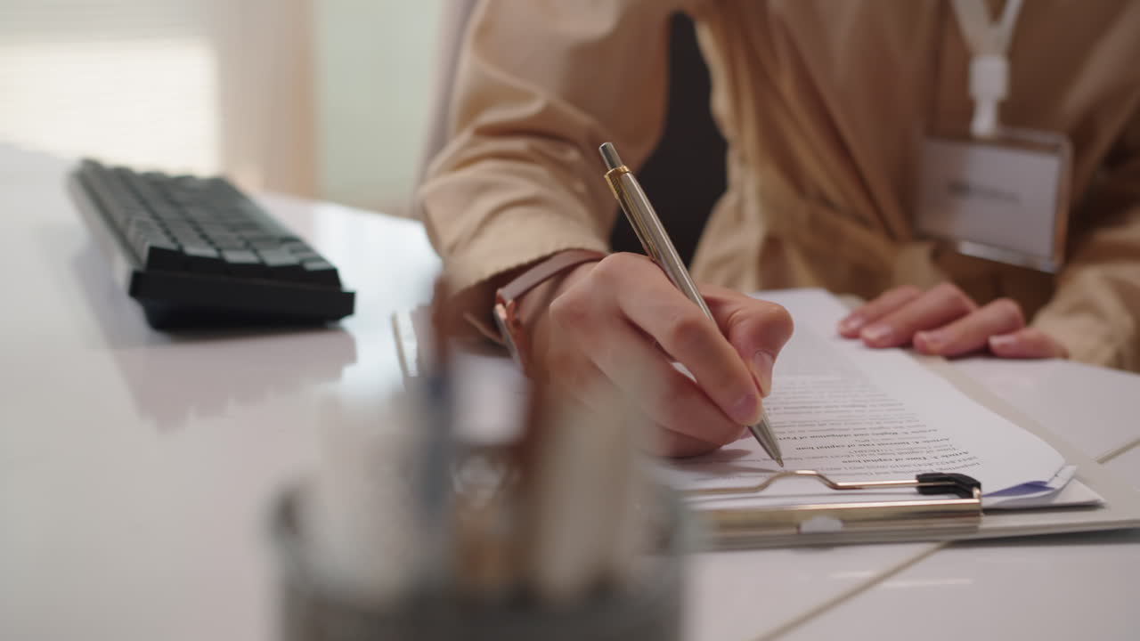 Hands of Bank Manager Filling Form