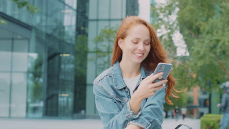 female vlogger or social influencer travelling through city for social media using mobile phone