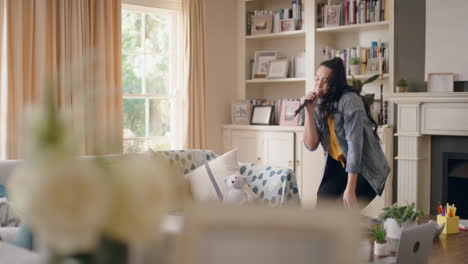 happy young woman dancing singing karaoke having fun teen girl celebrating with cool dance moves at home enjoying freedom on weekend 4k