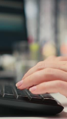 vertical video close up of woman executive assistant does report writing at desk