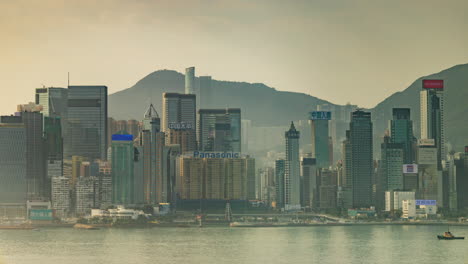 hong kong - 19 march 2025 : timelapse of the hong kong skyline and victoria harbour from a high vantage point in the morning