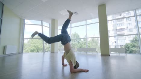 young girl breakdancing in modern studio