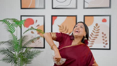 Excited-Indian-woman-throwing-money-in-air