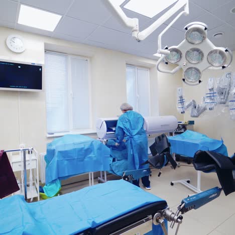 nurse in a modern operating room. medical robotic equipment for surgery in clinic. nicely equipped surgical cabinet. new technologies in medicine.
