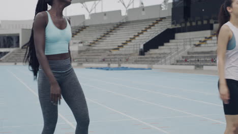 two female athletes catching their breath