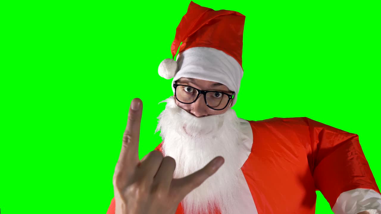 산타클로스가 시청자에게 엄지손가락을 올리는 클로즈업입니다.