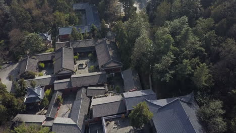 low aerial flyover tilt looks down on wu wei si kung fu school, china