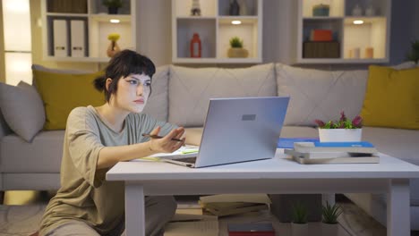 young woman encountering problem on laptop. the young woman is angry and trying to figure it out.