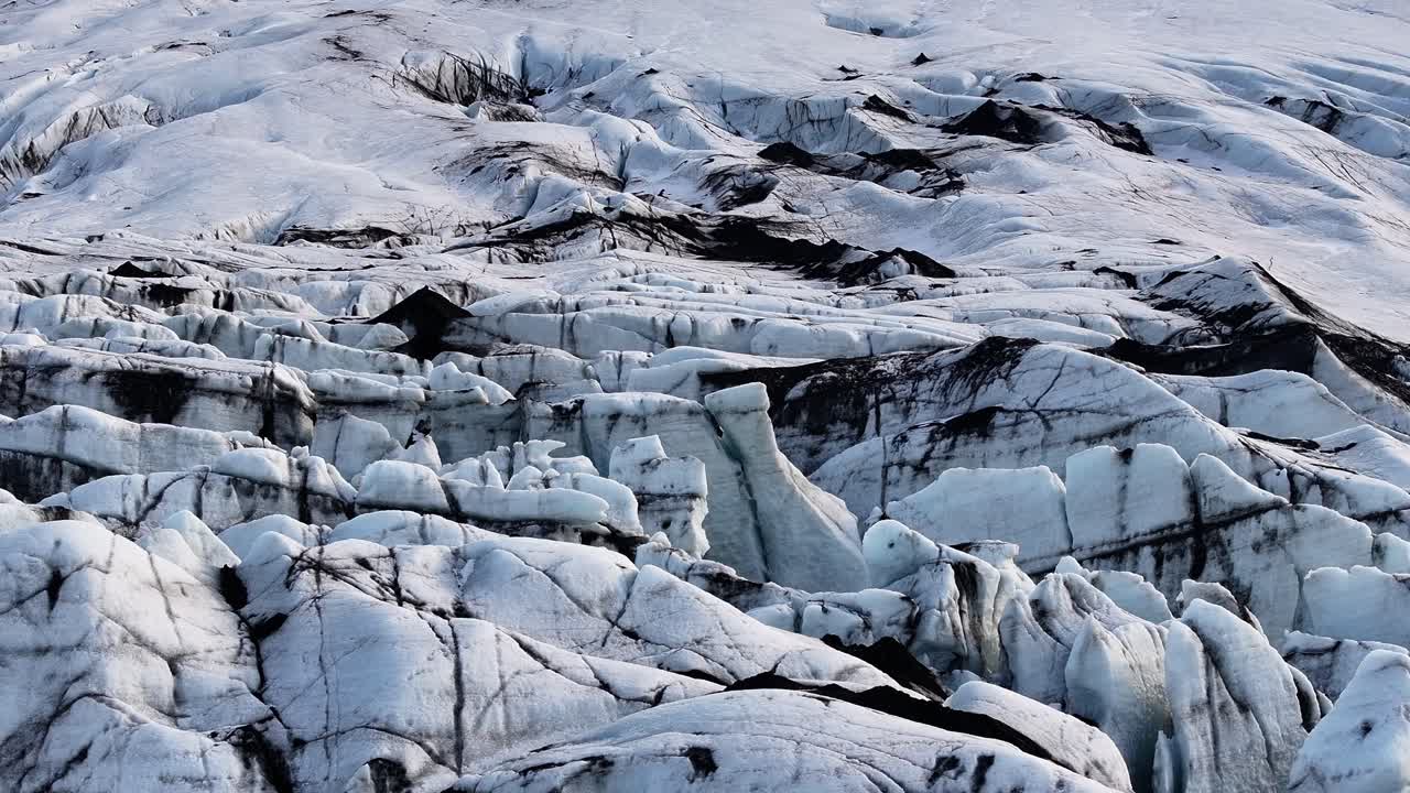 Detailed view of Iceland’s Sólheimajökull Glacier, cracked ice, dark ash layers and melting textures, ideal for climate change visuals.