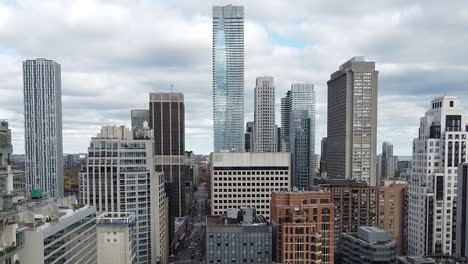 aerial of tall urban city commercial and residential building developments