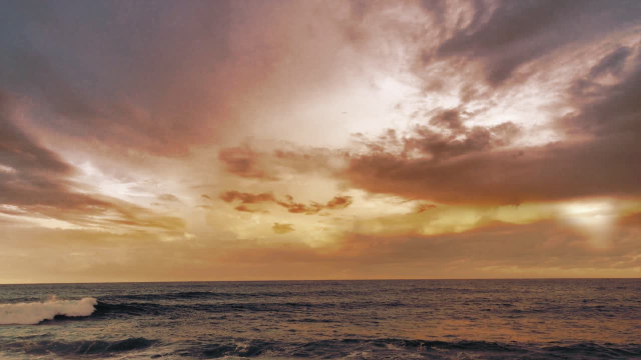 the sea with sunset clouds