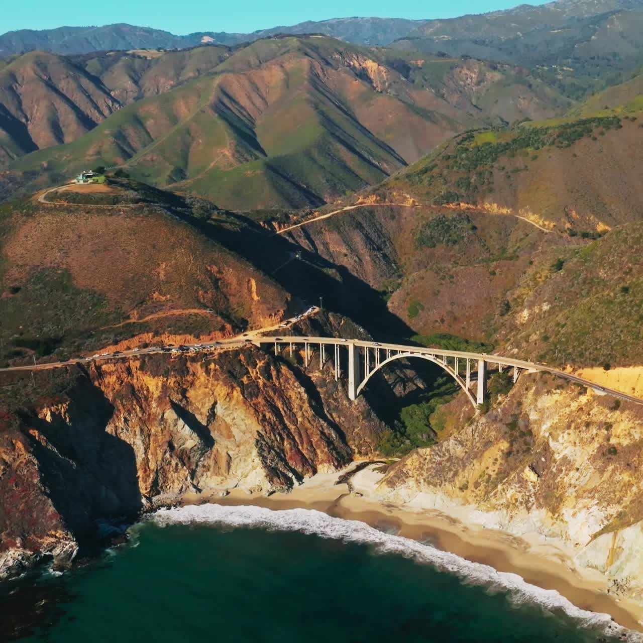 Bixby Creek Bridge on the Big Sur coast of California. Aerial view of big bridge on rocky landscape