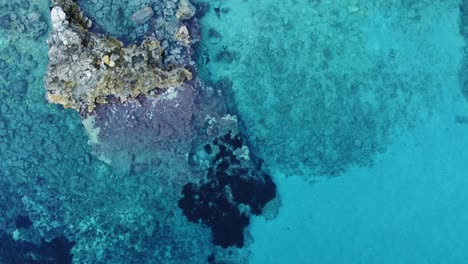 wonderful geological rock formations in turquoise clear ocean water