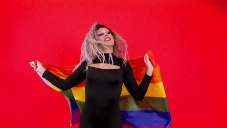 drag queen with rainbow flag on red background
