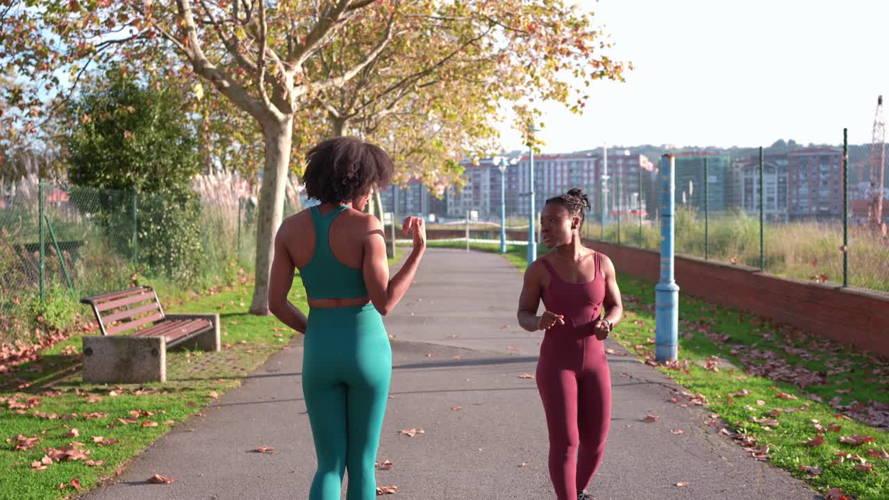 Two Women Exercising in the Park