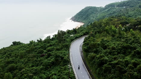 Hoi-na-Vietnam-Beach-next-to-street-on-cloudy-and-rainy-day-with-green-jungle-trees