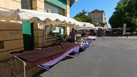 outdoor market with clothes and toys for sale