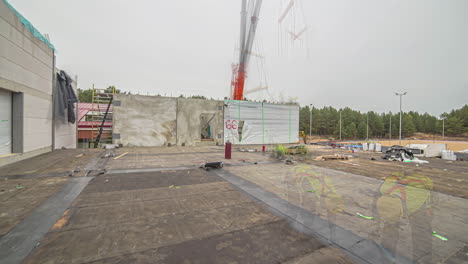 timelapse shot of crane lifting up and placing the white containers shaped rooms at daytime