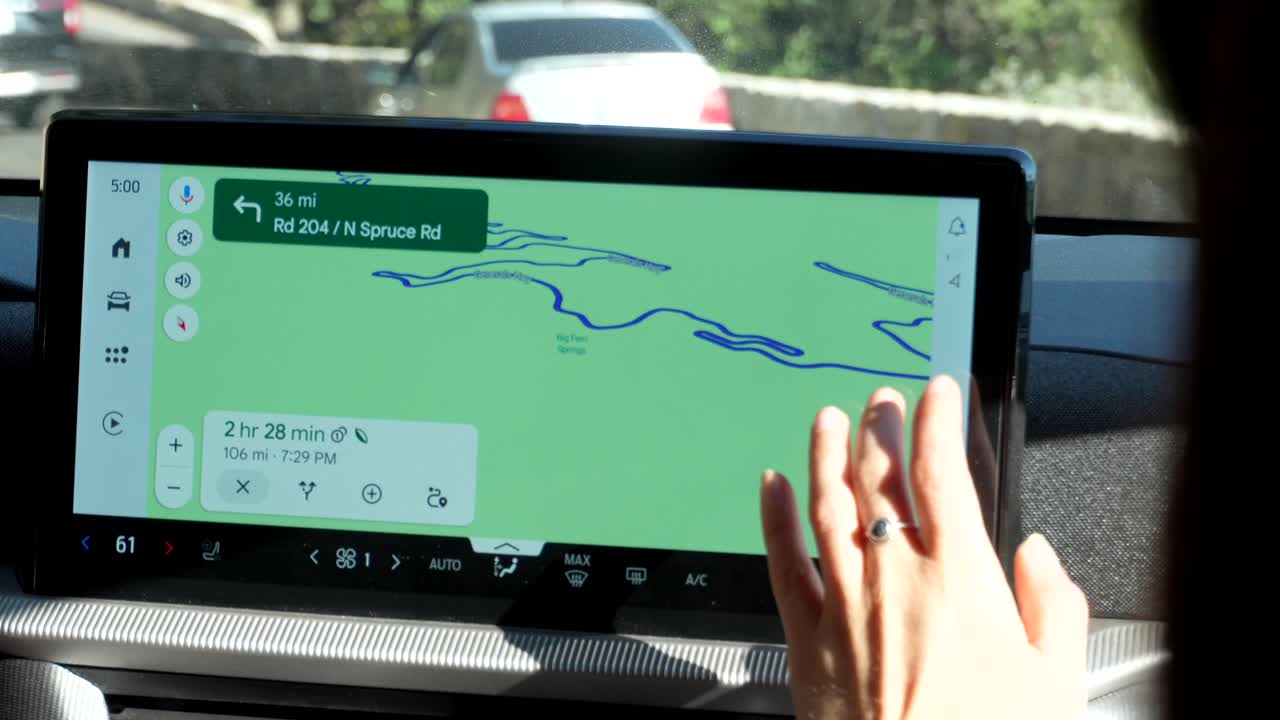 Close-up of Hand Zooming on Car Navigation Map