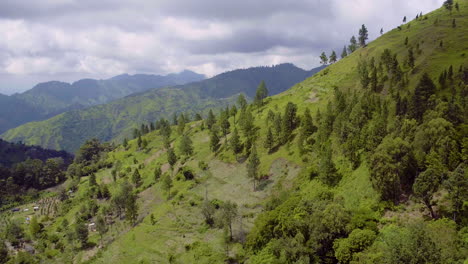 climbing aerial view of the blue mountains in jamaica showing a steep slope and side view of the mountain
