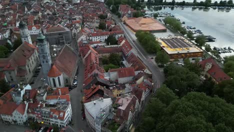 aerial drone footage showcases the city nestled beside the iconic lake of constance, highlighting its picturesque landscape and waterfront charm