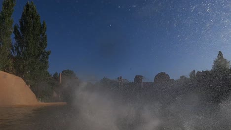 First-person-view-of-adrenaline-roller-coaster-splashing-down-at-amusement-park