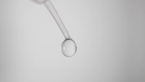 droplets of extraction buffer from pipette for covid-19 rapid test