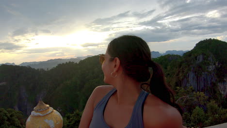 slow motion | close up - beautiful indian girl on mountain in thailand -smiling at sunset