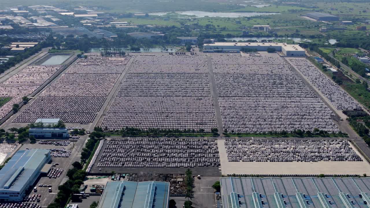 Massive inventory of unsold cars parked at an open warehouse beside Hyundai Motors India manufacturing plant in Chennai, Aerial view