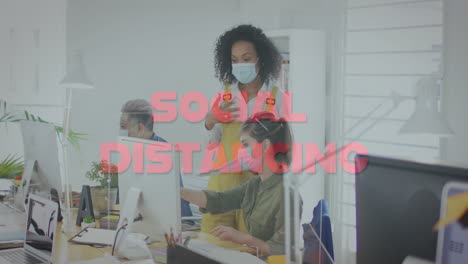 animation of words social distancing with colleagues in office wearing face masks